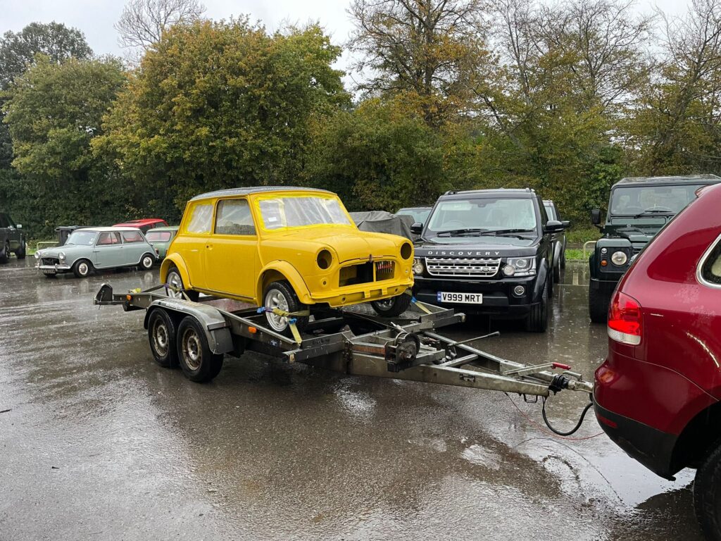 A classic Mini on its way to being converted to electric power in our workshop after a full respray.